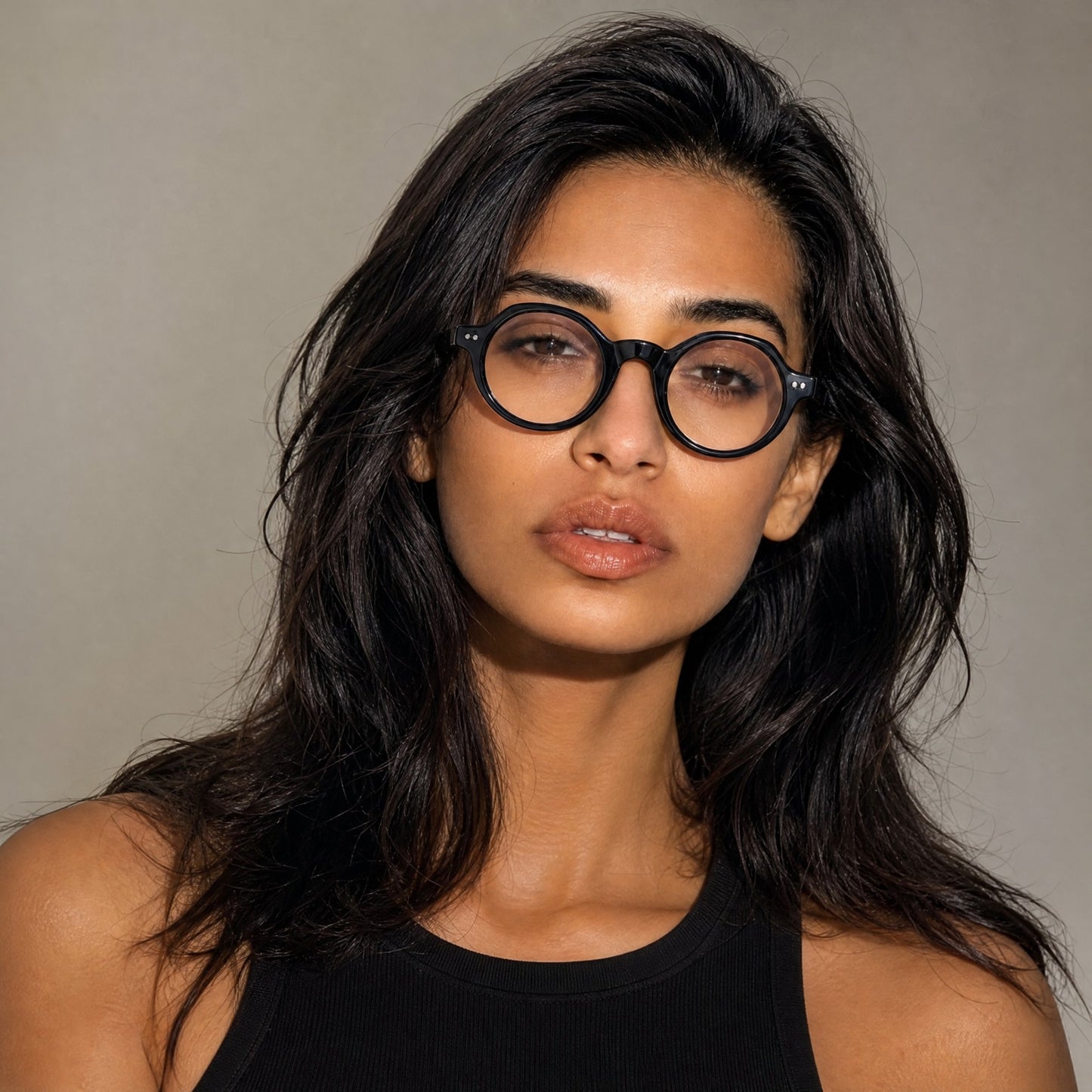 Nadaraty Eyewear Horus Inferno matte black acetate round optical frames on a woman.