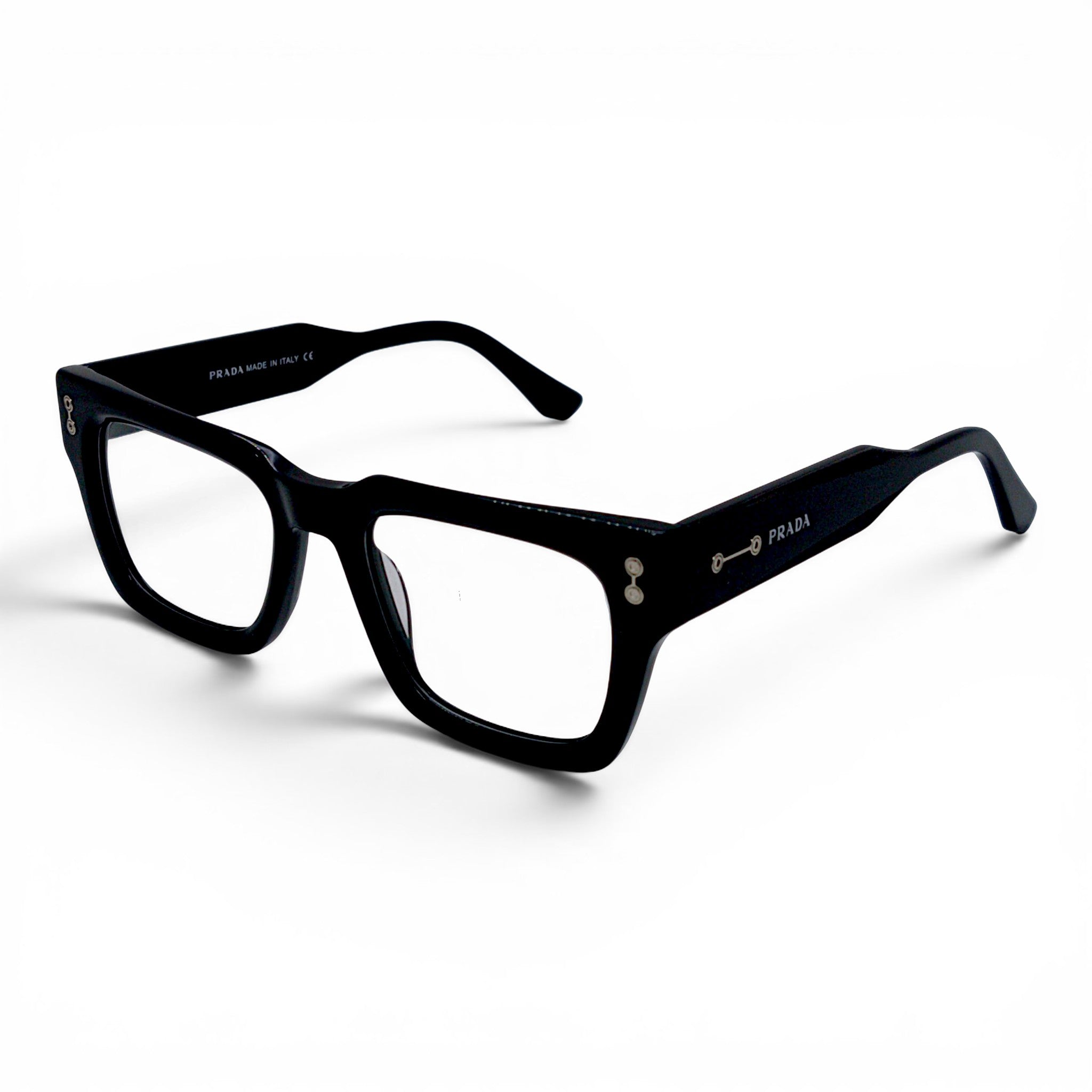 Nadaraty Eyewear black acetate rectangular eyeglasses with silver accents and Prada logo on the temple.