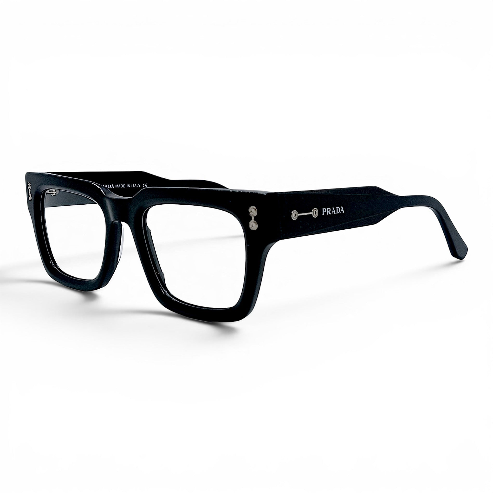 Nadaraty Eyewear black acetate square frame glasses with silver accents and PRADA logo on the temple.