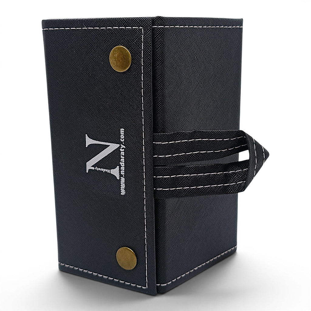 Black glasses organizer case by nadaraty eyewear with snap closure and loop handle. Stores 5 pairs.