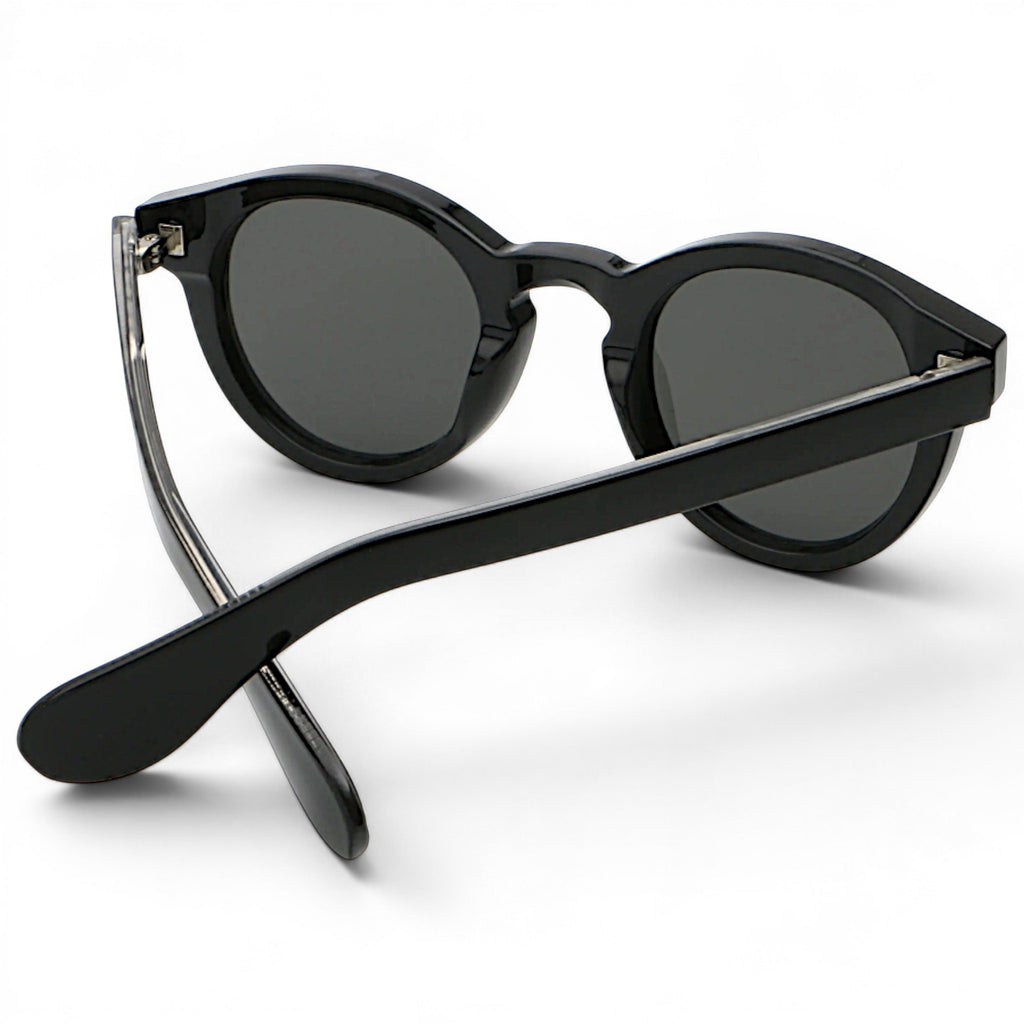 nadaraty eyewear Horus Darko H 194 black acetate round sunglasses with dark grey lenses.