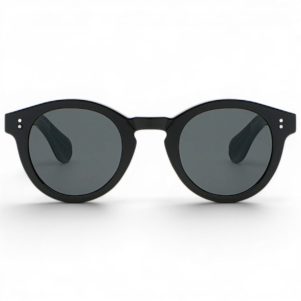 nadaraty eyewear Horus Darko H 194 black round acetate sunglasses with dark grey lenses and silver dot accents.