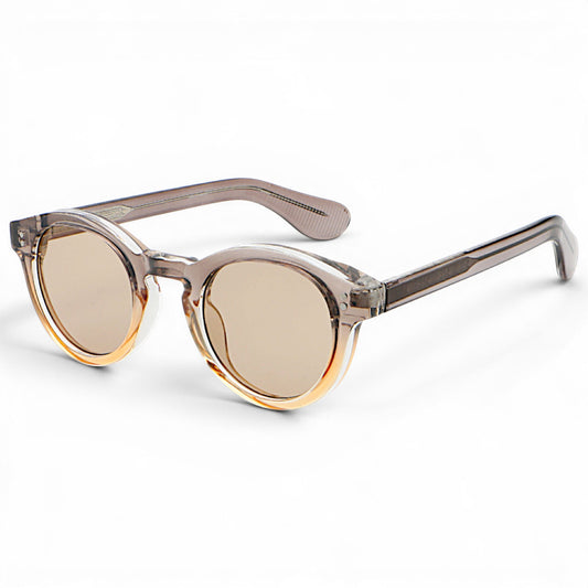 nadaraty eyewear Horus Darko H 194 clear acetate round sunglasses with brown gradient lenses and subtle orange accents.