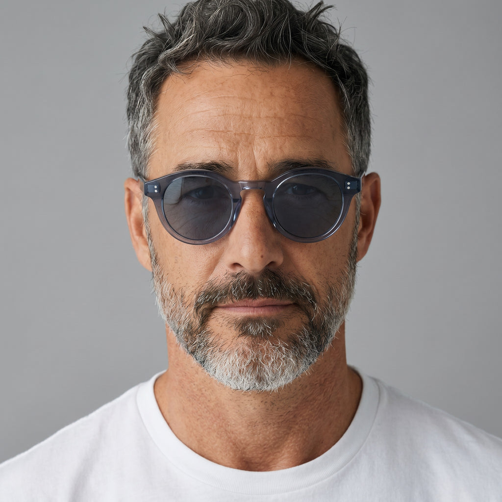 nadaraty eyewear Horus Darko - H 194 translucent dark grey round acetate sunglasses with dark tinted lenses and double dot embellishments.