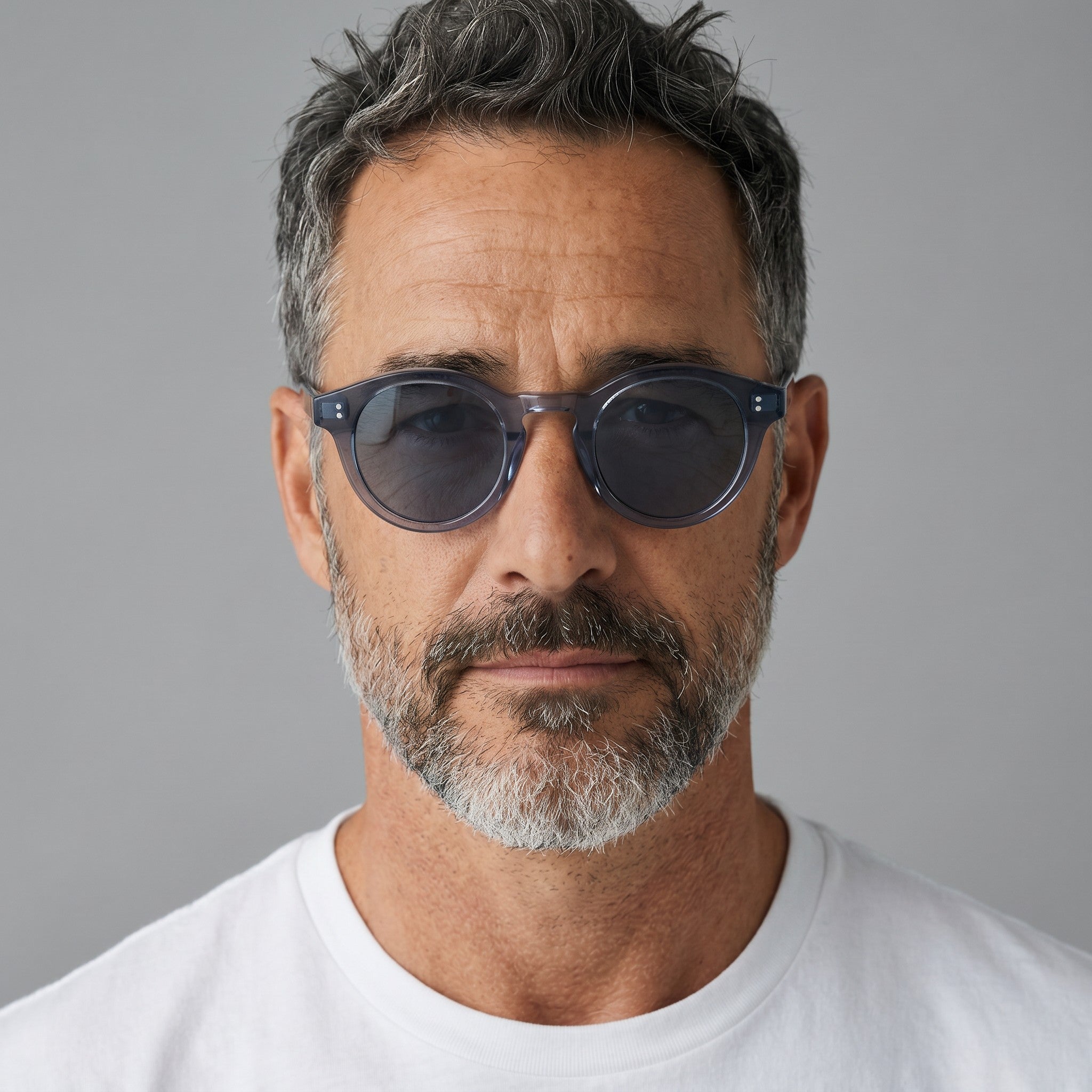 nadaraty eyewear Horus Darko - H 194 translucent dark grey round acetate sunglasses with dark tinted lenses and double dot embellishments.