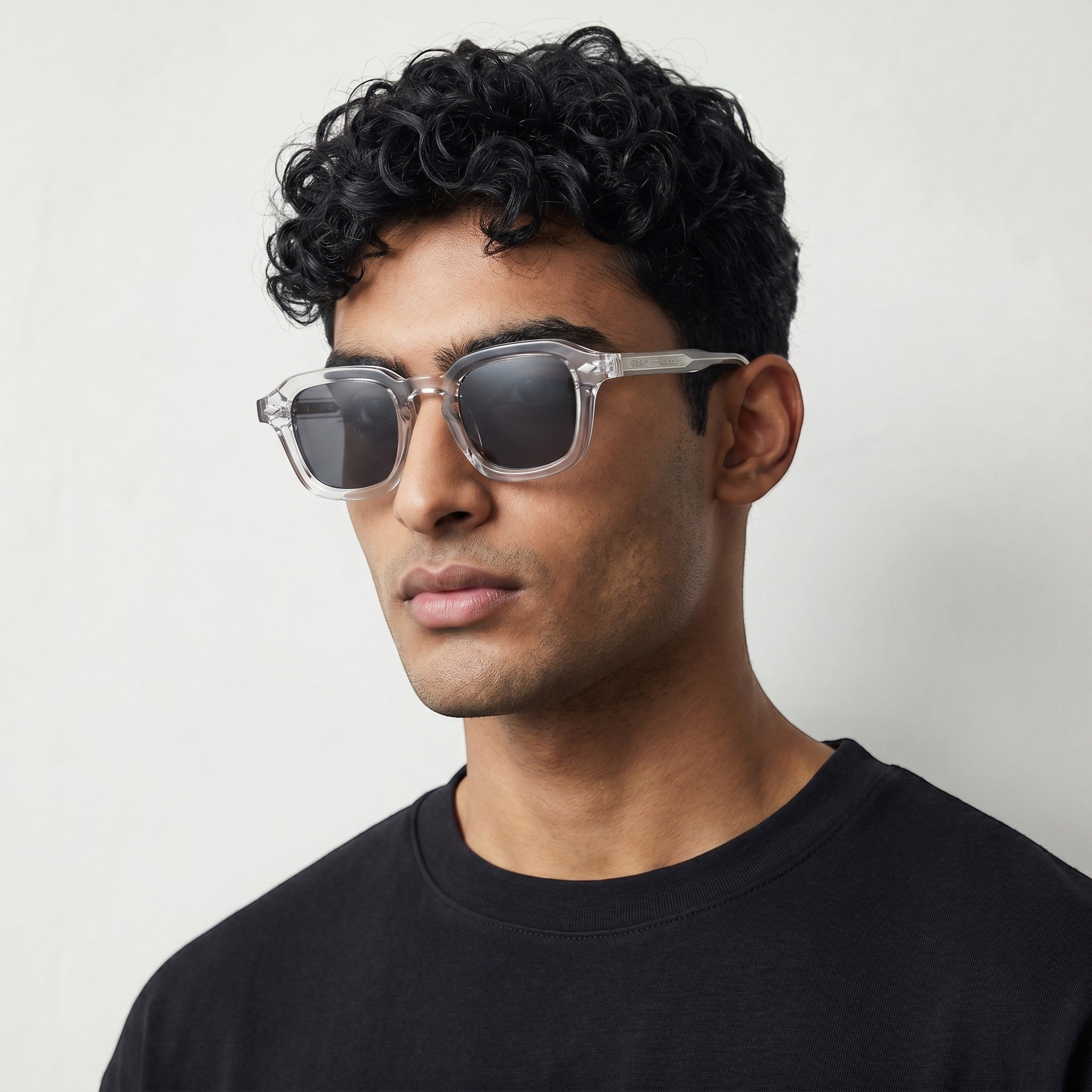 nadaraty eyewear Horus Dilta H 82 clear acetate square sunglasses with black lenses.