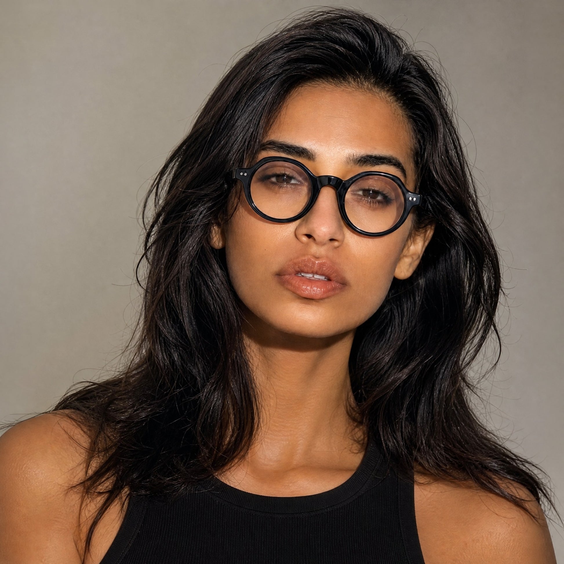 Nadaraty Eyewear Horus Inferno matte black acetate round optical frames on a woman.