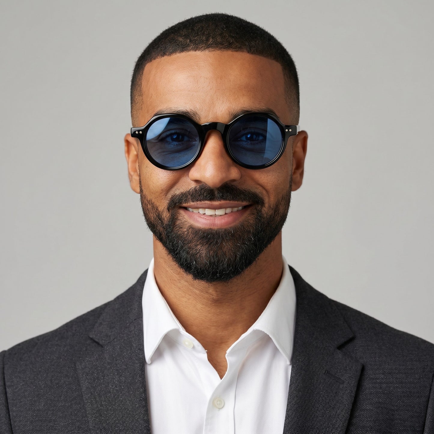nadaraty eyewear Horus Inferno black acetate round sunglasses with bright blue polarized lenses.