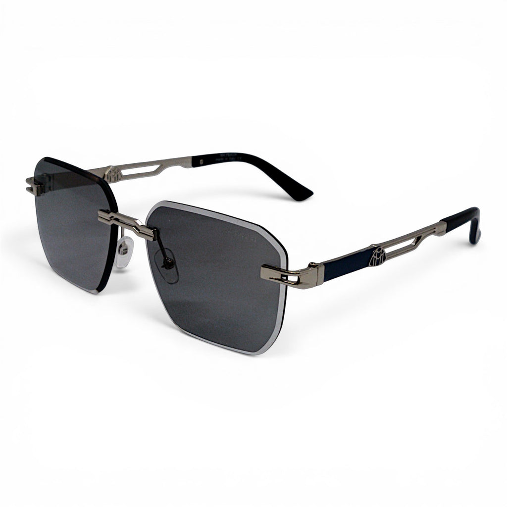 nadaraty eyewear May 02 rimless photocromic blue cut sunglasses with dark grey lenses and silver accents.