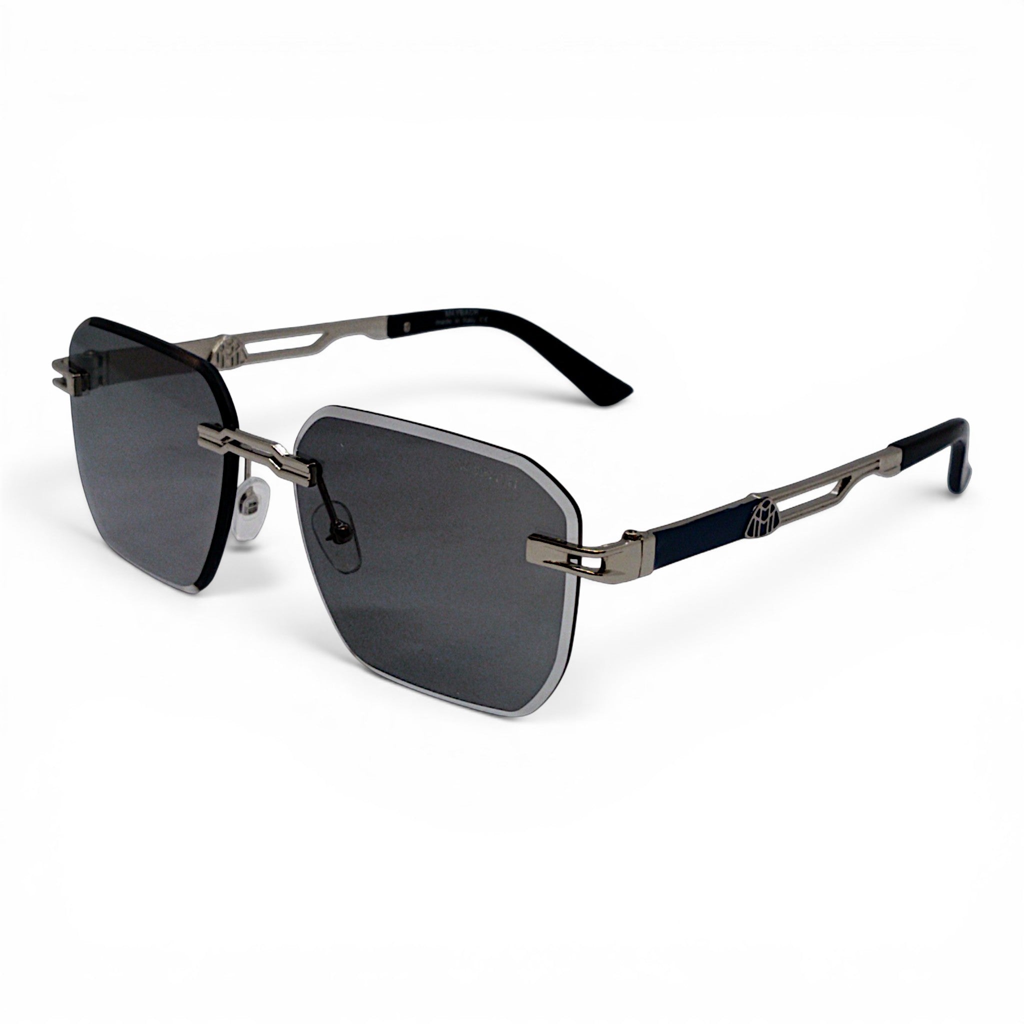 nadaraty eyewear May 02 rimless photocromic blue cut sunglasses with dark grey lenses and silver accents.