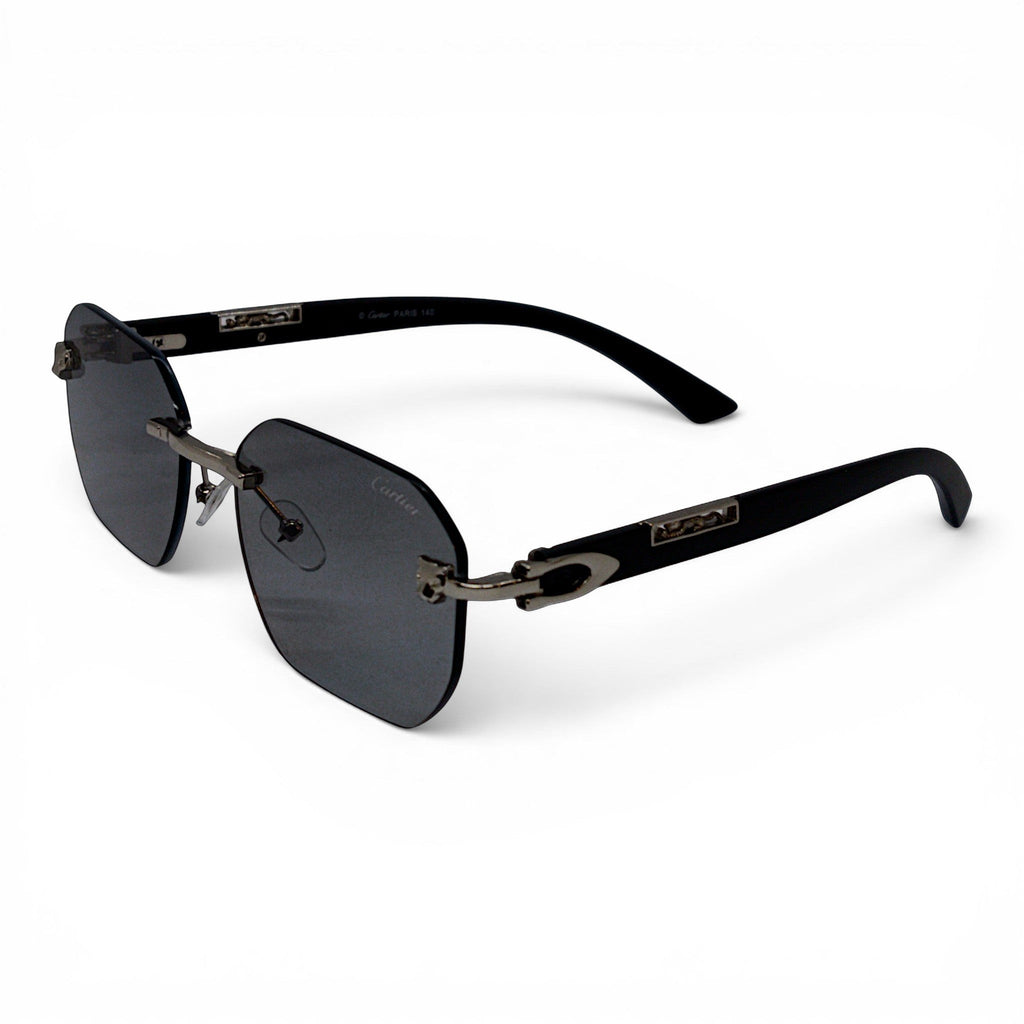 nadaraty eyewear Photocromic ctr 01 rimless sunglasses with dark grey lenses and black arms featuring silver C detail.