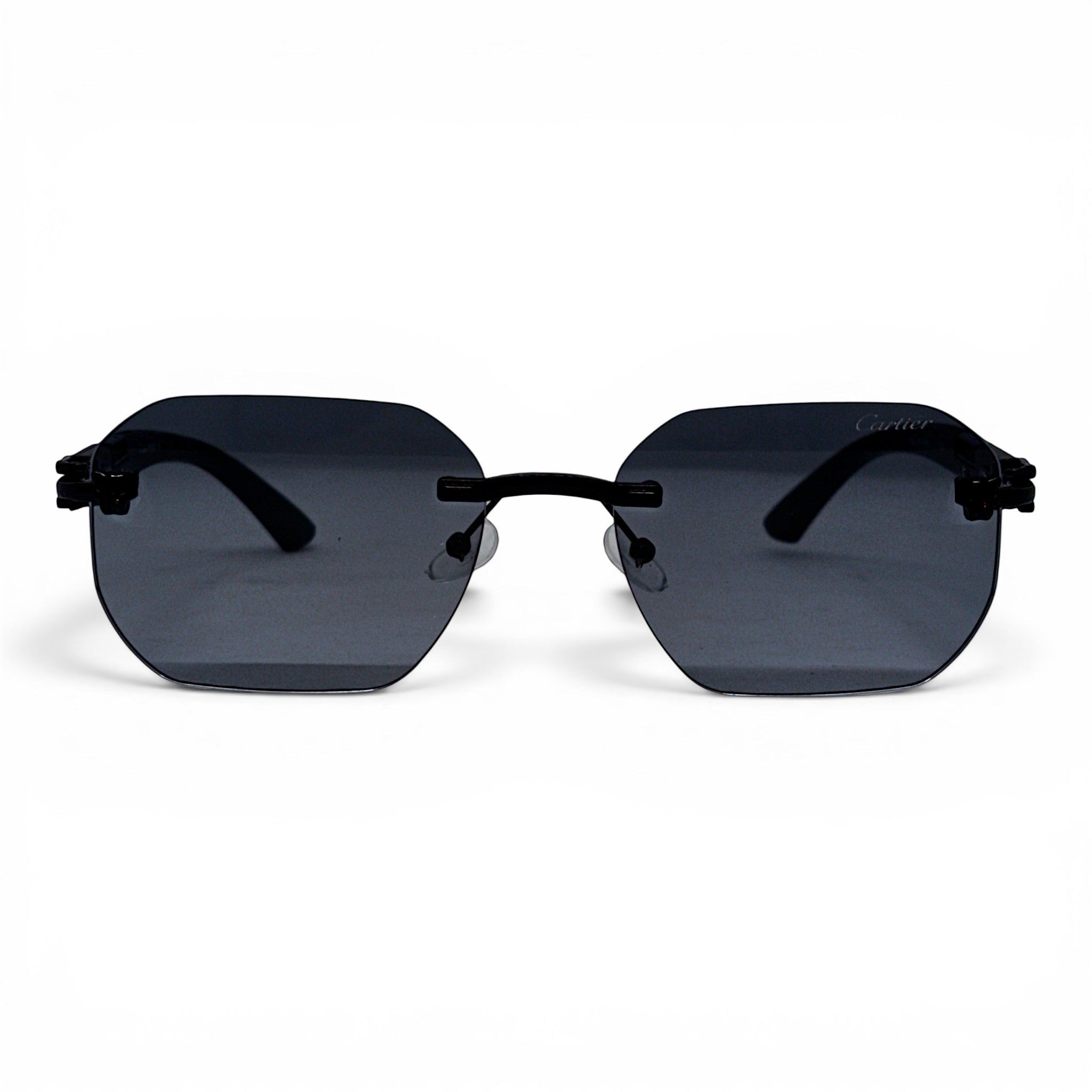 nadaraty eyewear Photocromic ctr 01 rimless octagonal sunglasses with dark grey lenses and black arms.