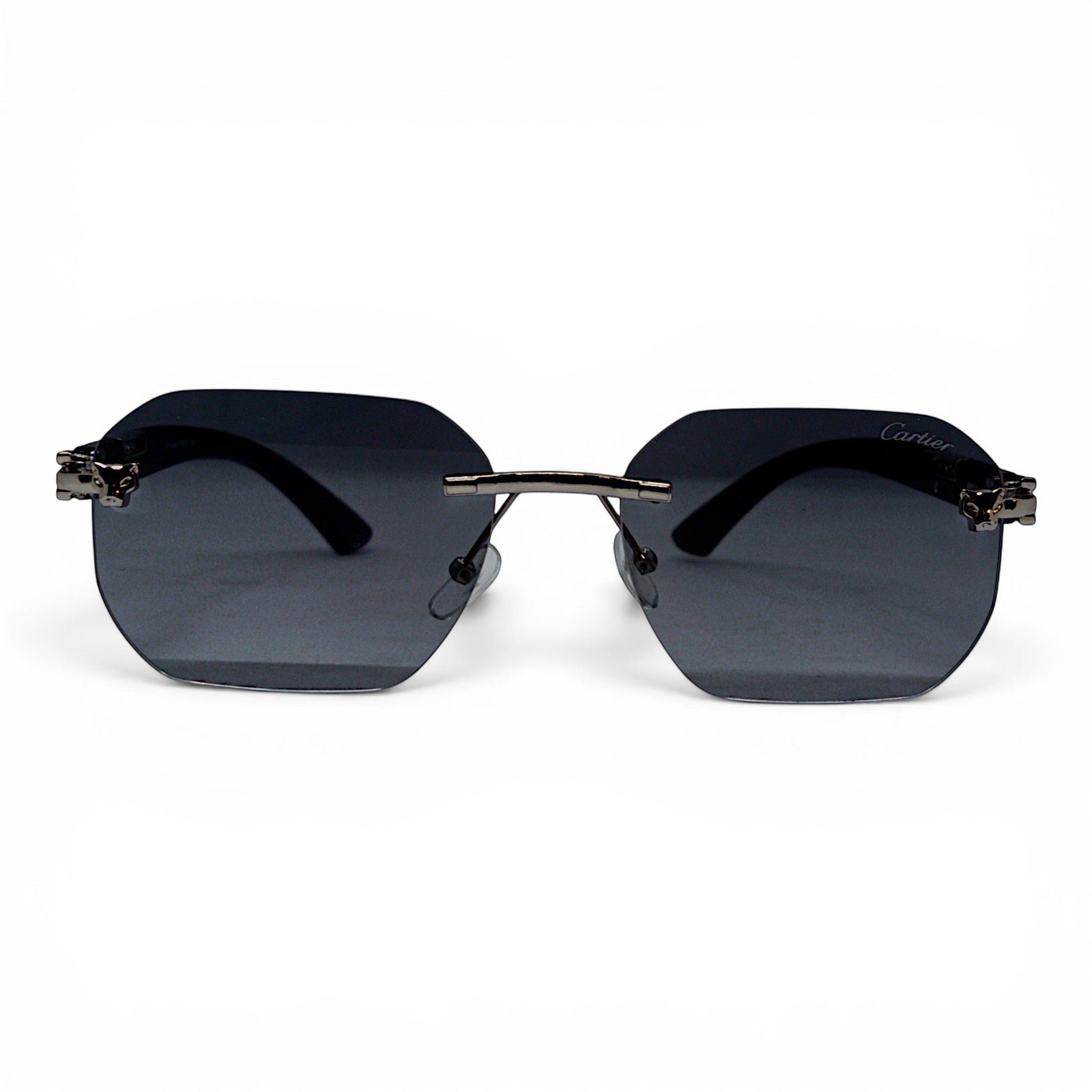 nadaraty eyewear Photocromic ctr 01 rimless octagonal sunglasses with dark grey lenses and silver temple accents.