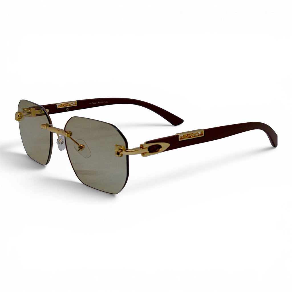 nadaraty eyewear Photocromic ctr 01 rimless sunglasses with gold accents and brown temples.